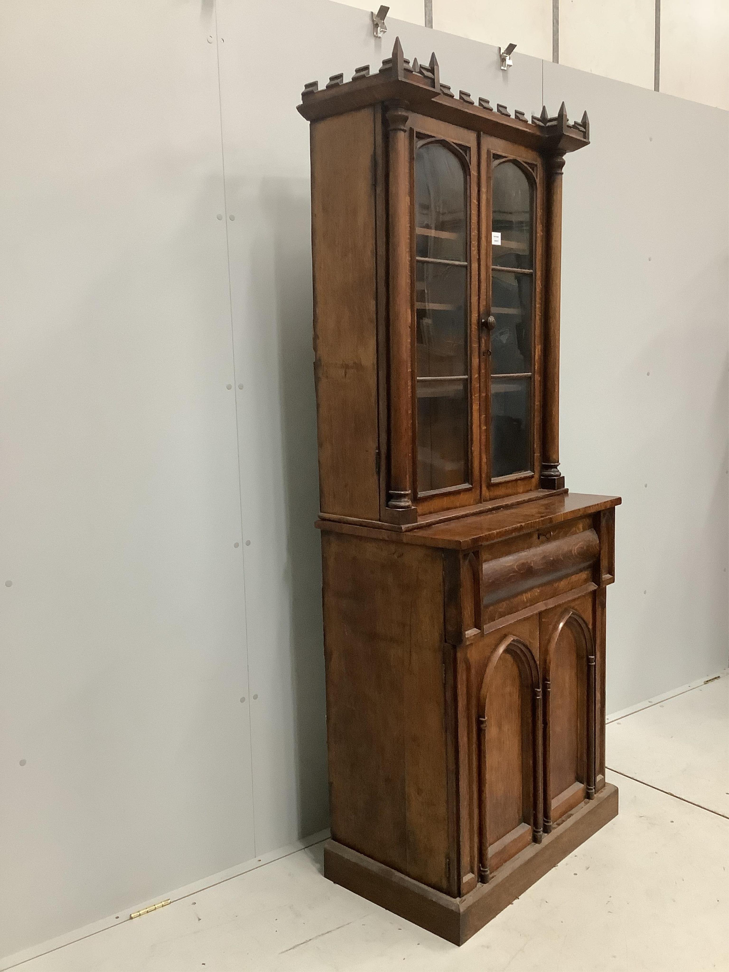 A William IV Gothic Revival oak secretaire bookcase, width 85cm, depth 47cm, height 209cm. Condition - poor to fair